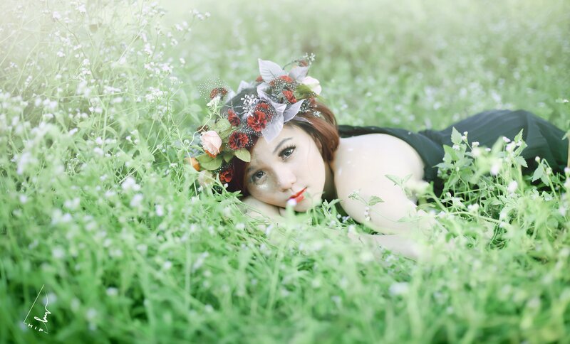 woman with flower crown in field
