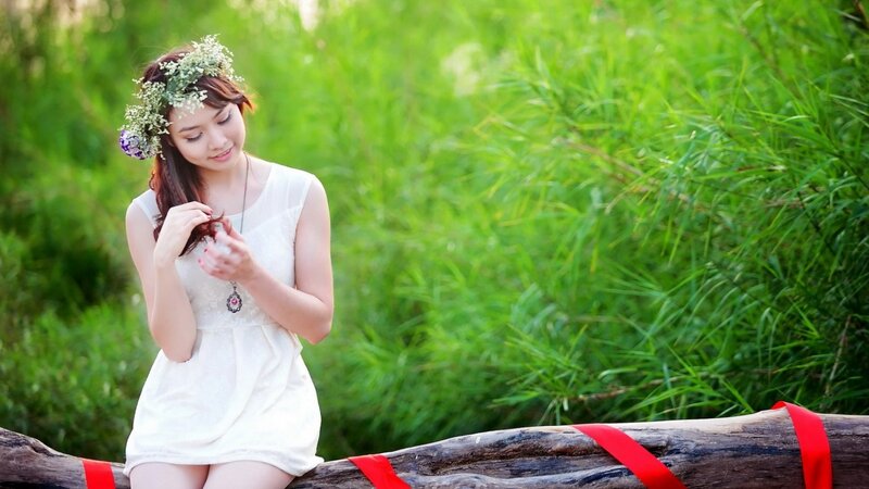 woman with flower crown in field