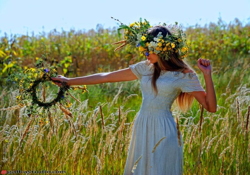 Woman with flower crown in field