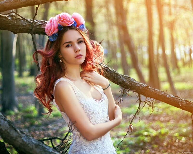woman with flower crown in forest