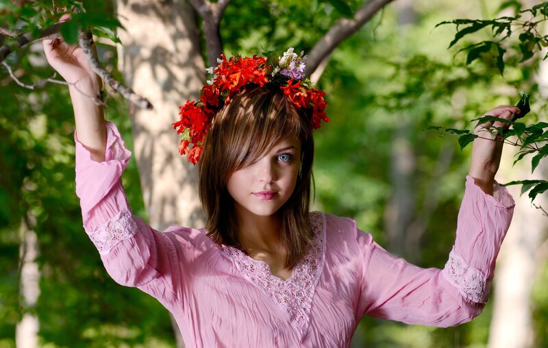 woman with flower crown in forest