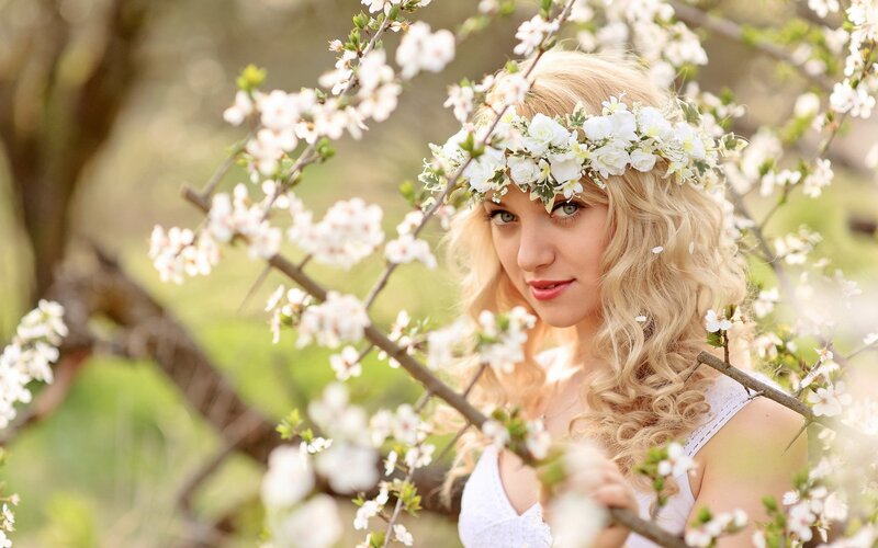 woman with flower crown in garden