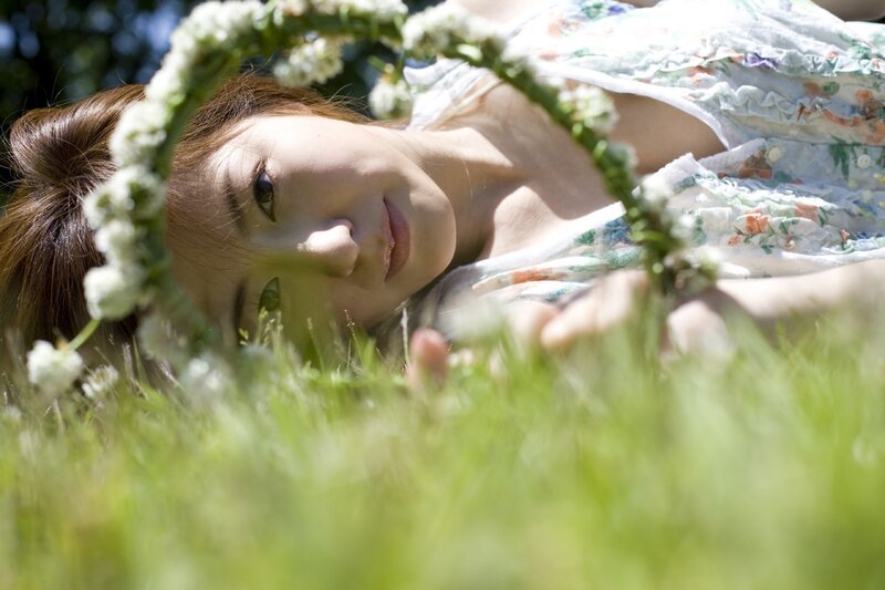 woman with flower crown in grass