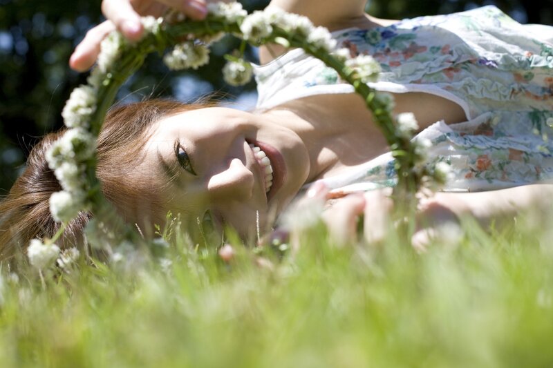 woman with flower crown in grass