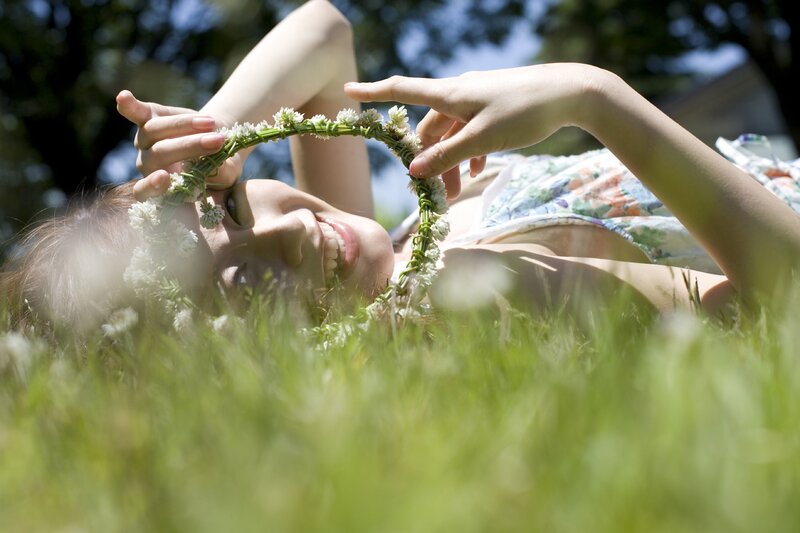 Woman with flower crown in grass
