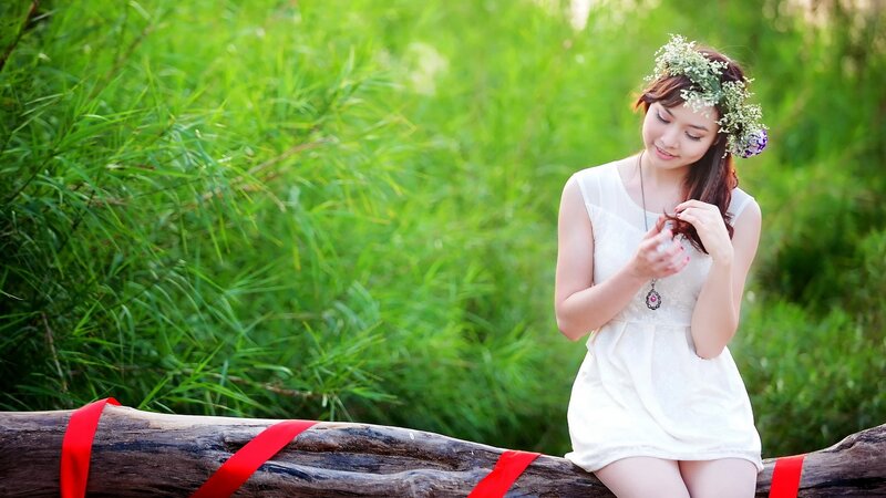 woman with flower crown in nature