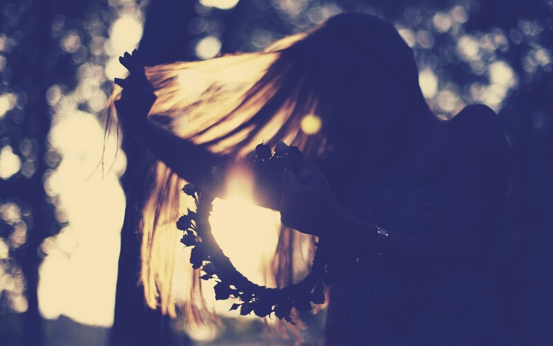 woman with flower crown in sunlight
