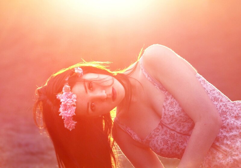 woman with flower crown in sunset