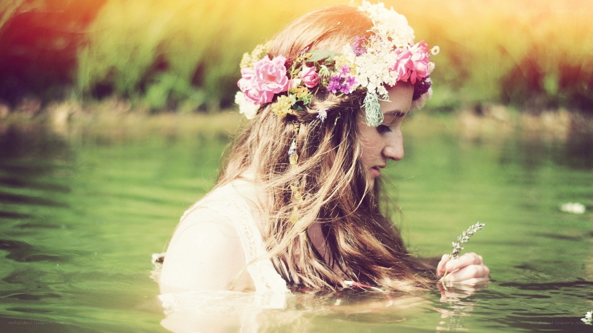 woman with flower crown in water