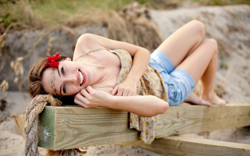 woman with flower crown on beach