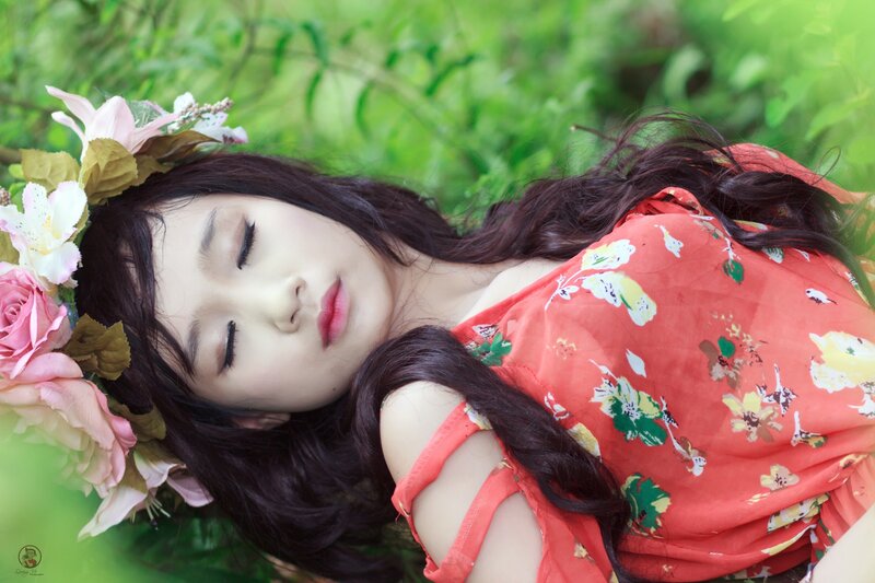 woman with flower crown sleeping