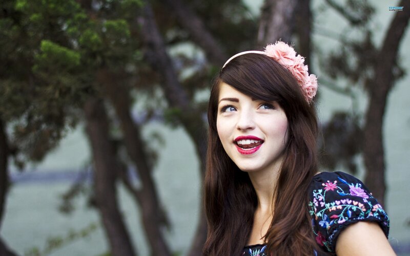woman with flower crown smiling