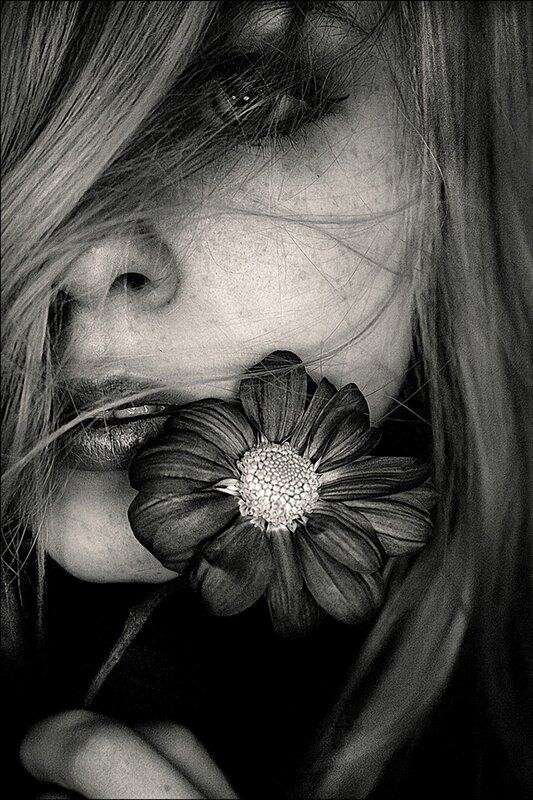 woman with flower in black and white