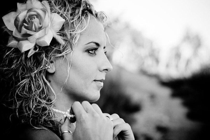 Woman with Flower in Hair — Black, Contemplative