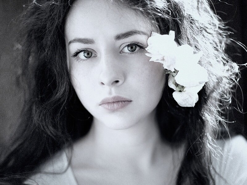 Woman with Flower in Hair — Black, Serious