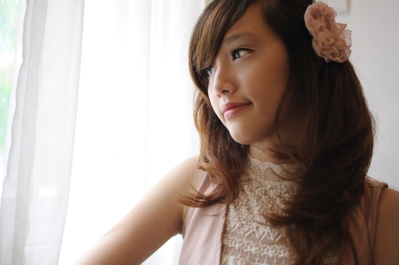 Woman with Flower in Hair — Brown, Serene, Morning