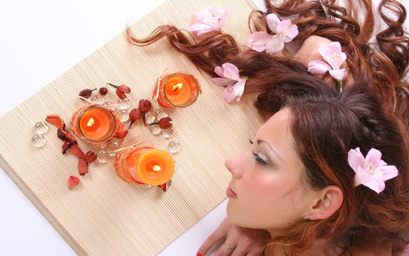 woman with flowers and candles