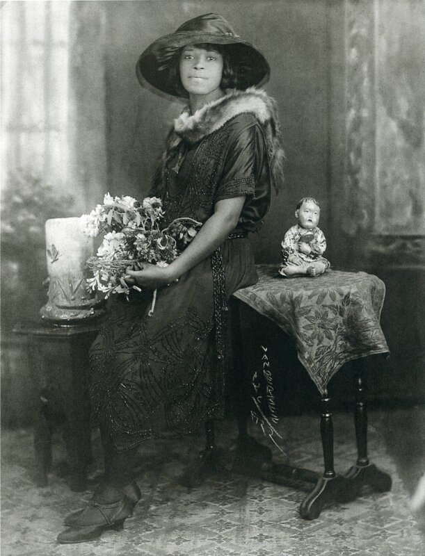 Woman with flowers and doll