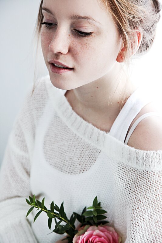 woman with flowers and freckles