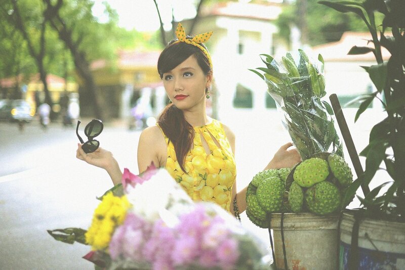 Woman with flowers and fruit