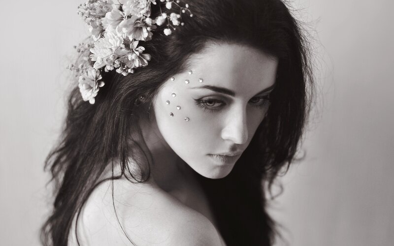 woman with flowers and gems
