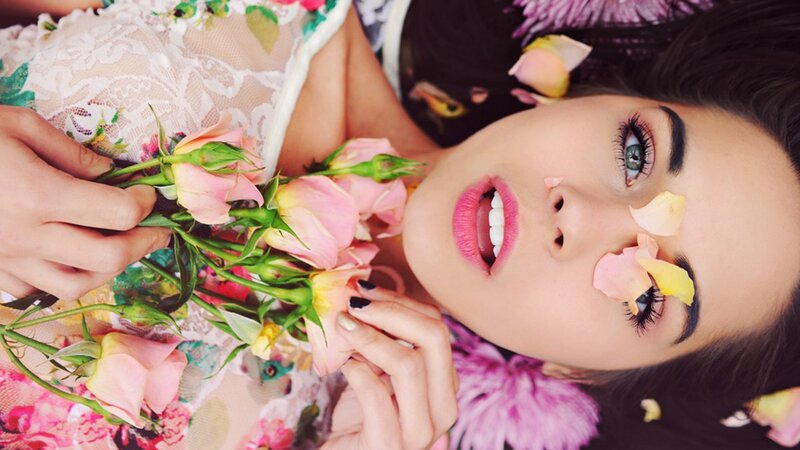woman with flowers and petals