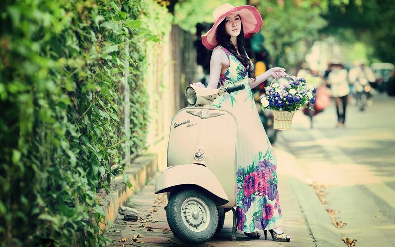 Woman with flowers and scooter