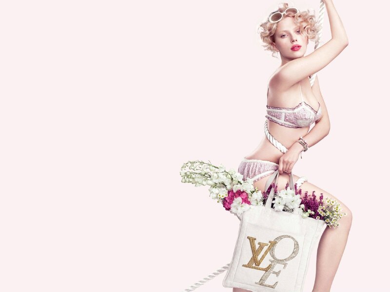 woman with flowers and tote bag