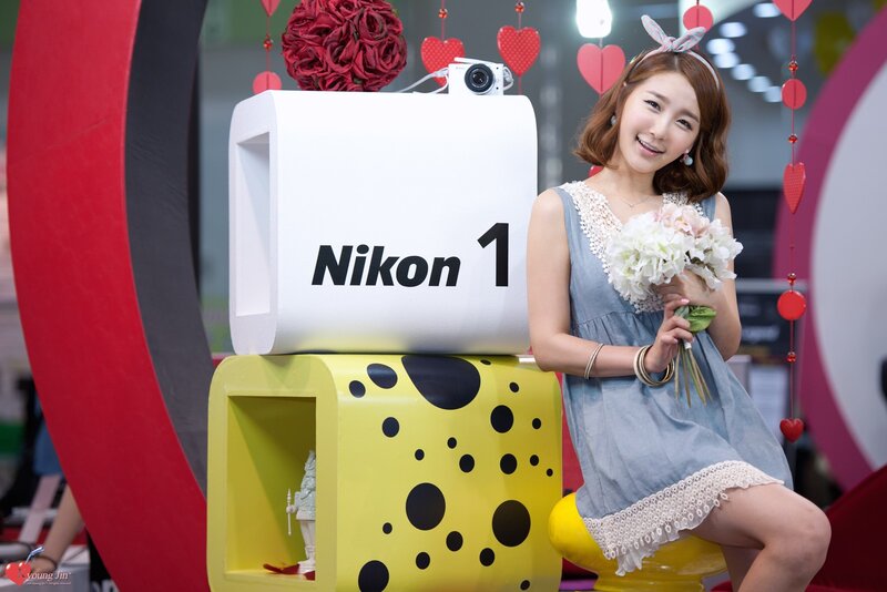 Woman with flowers at Nikon event