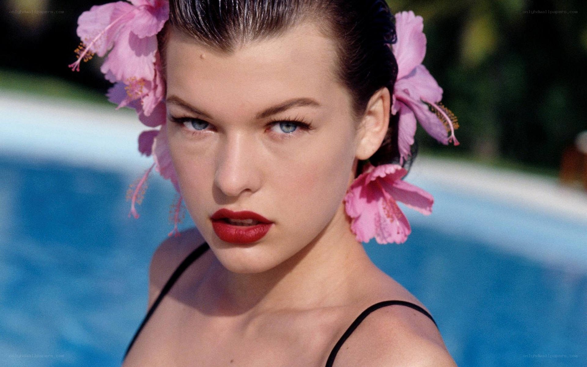 woman with flowers by pool