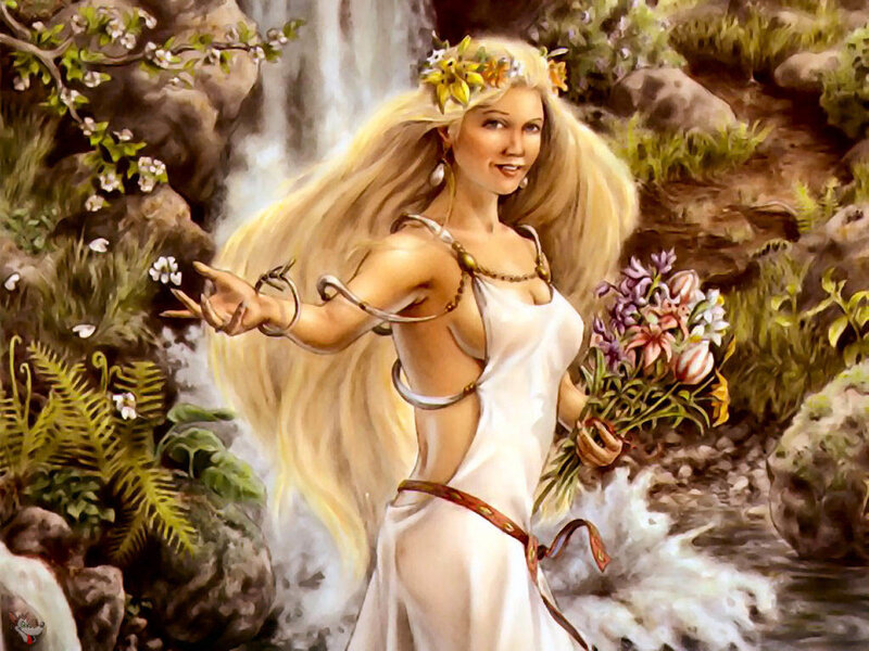 Woman with flowers by waterfall