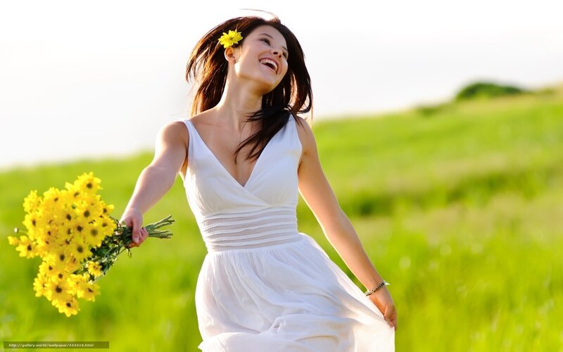 Woman with flowers in a field
