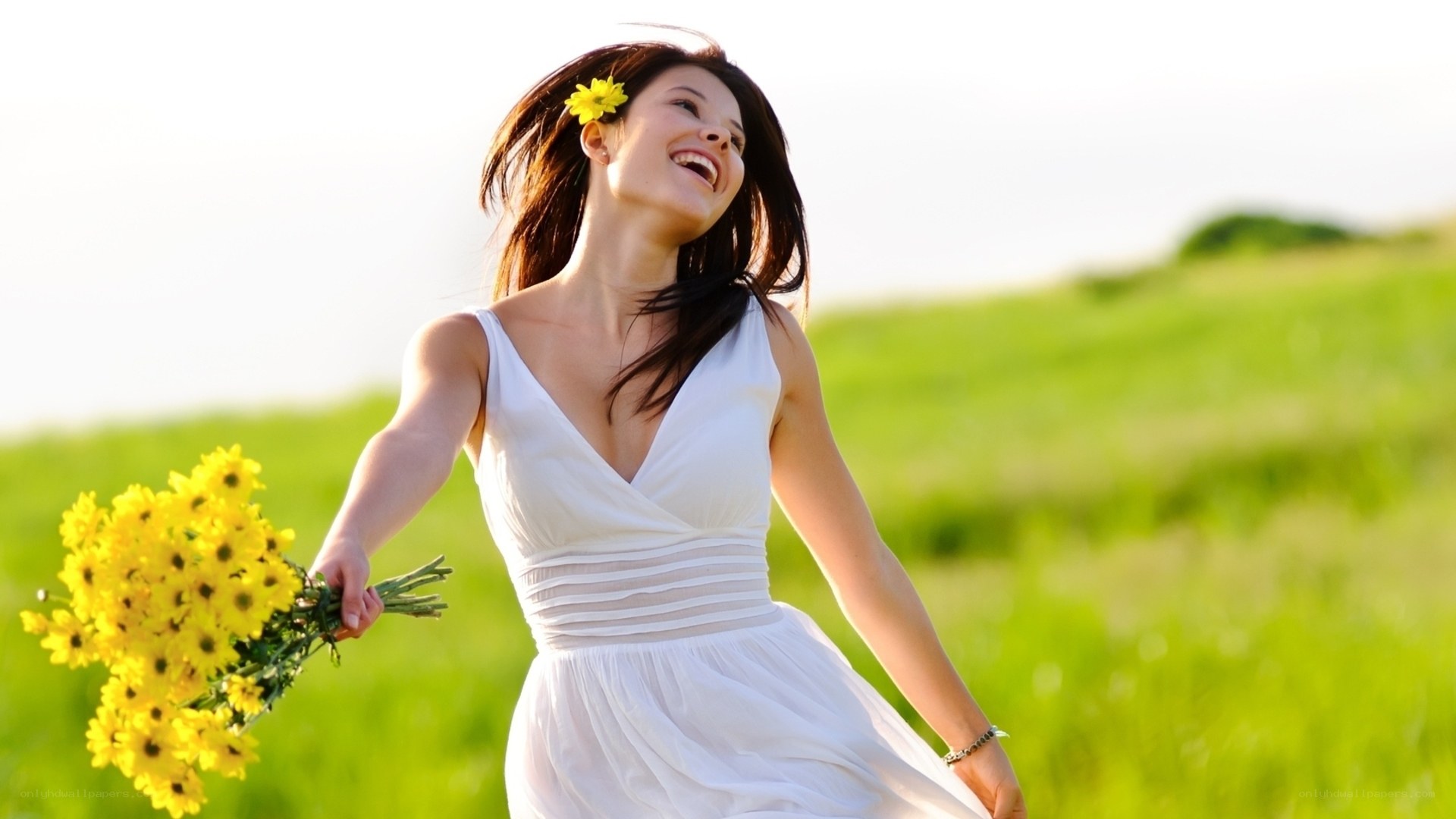 Woman with flowers in a field