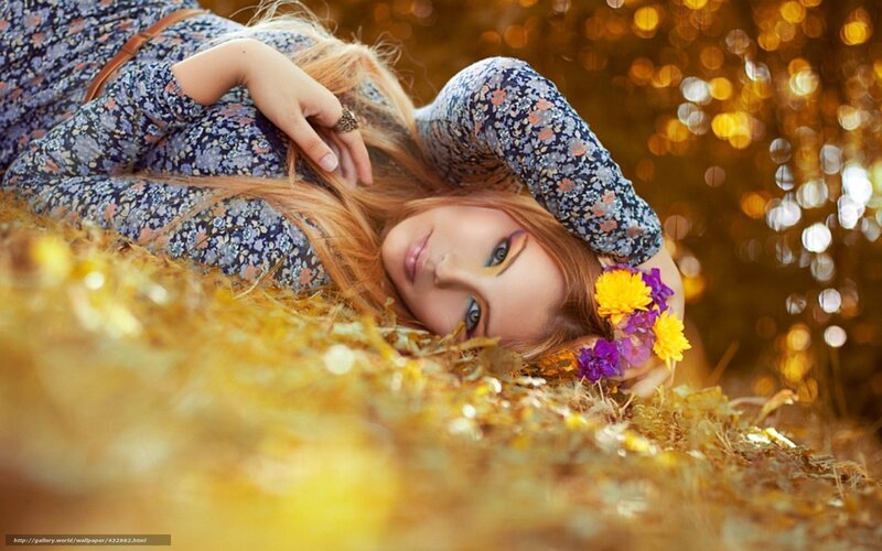 Woman with flowers in autumn