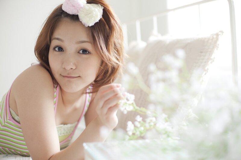 woman with flowers in bedroom