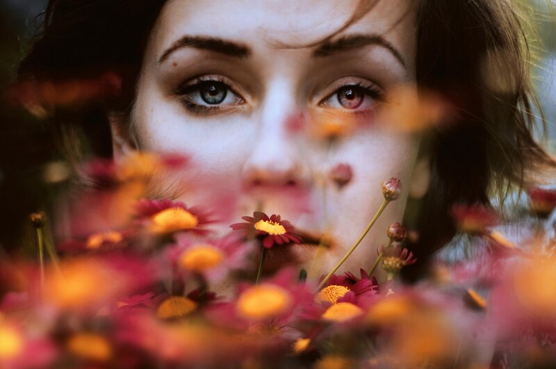 woman with flowers in foreground