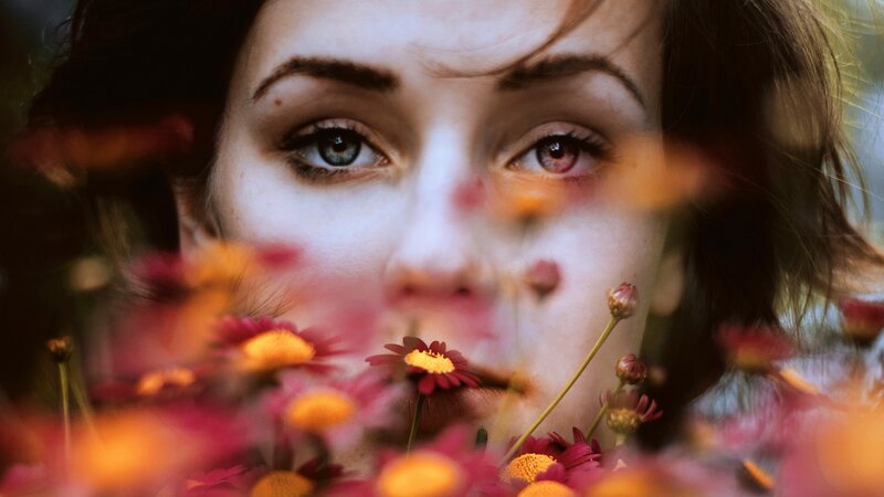 woman with flowers in foreground