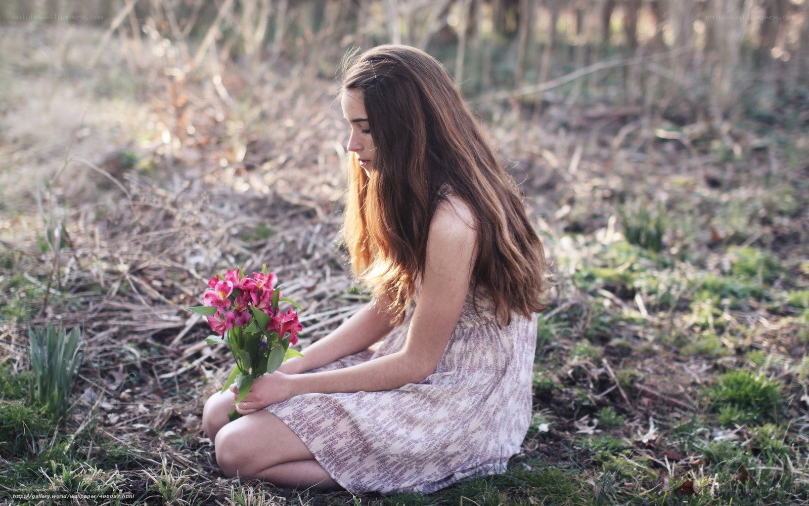 Woman with flowers in forest