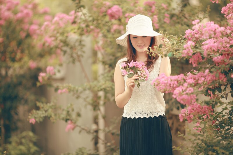 Woman with flowers in garden