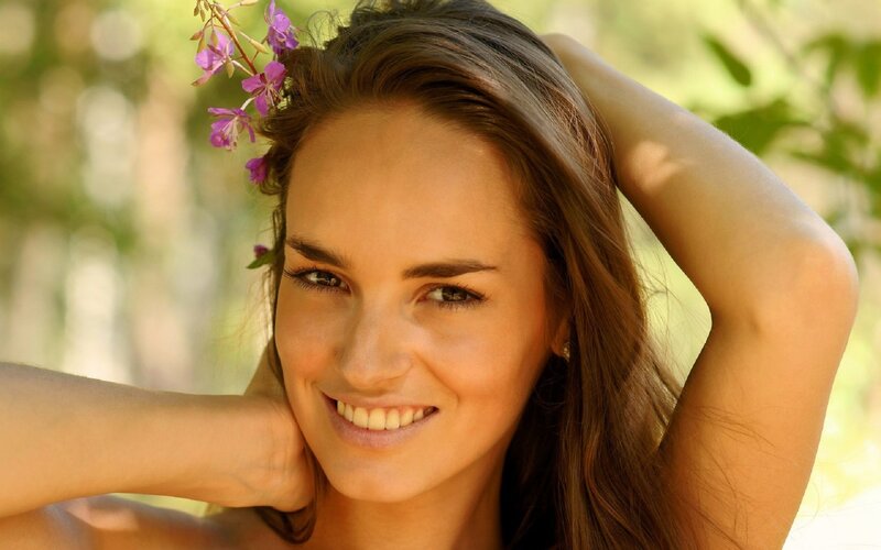 Woman with Flowers in Hair — Brown, Serene, Afternoon, Photograph, Smile, Green