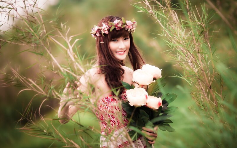 woman with flowers in nature