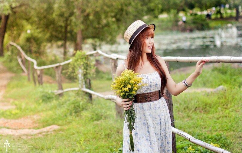 Woman with flowers in park