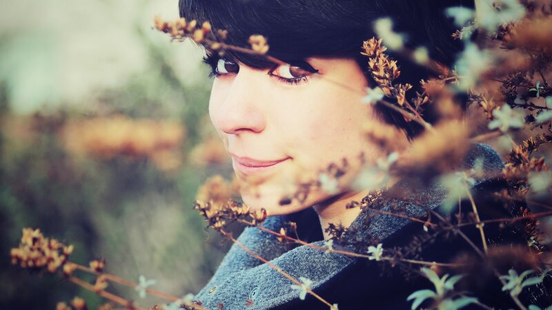woman with flowers in profile
