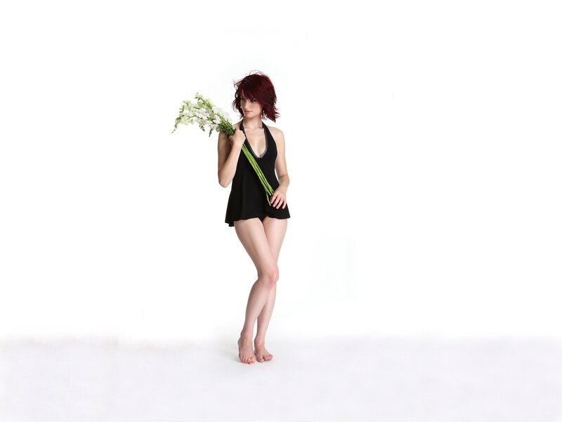 Woman with flowers in studio