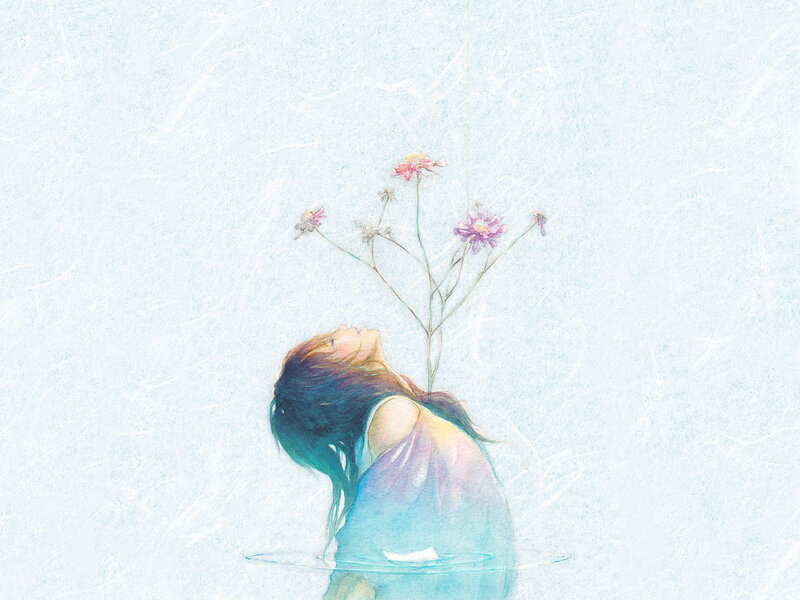 woman with flowers in water