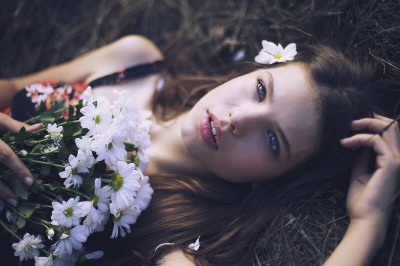 woman with flowers lying down