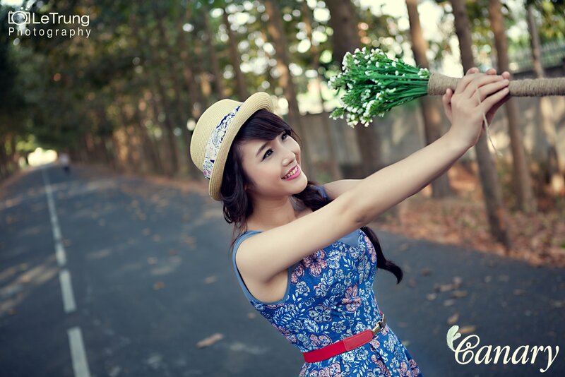 Woman with flowers on a road