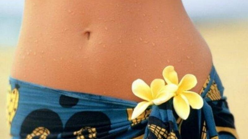 woman with flowers on beach
