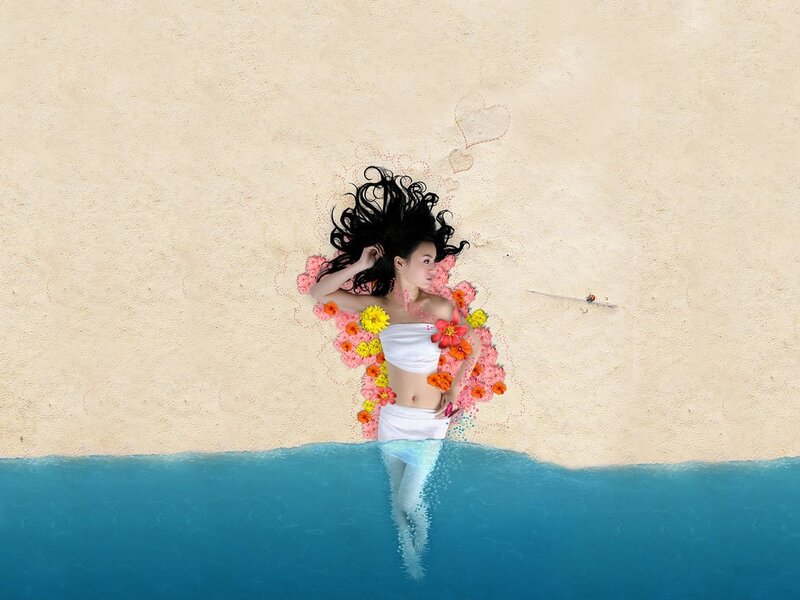 woman with flowers on beach