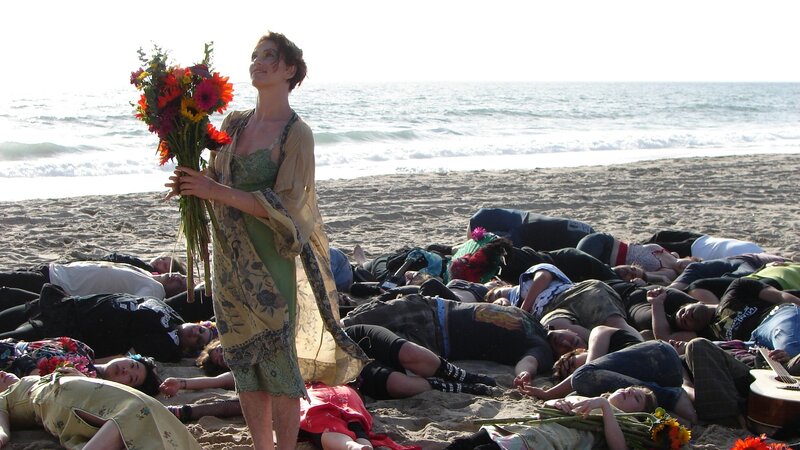 Woman with flowers on beach